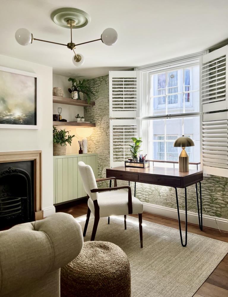 The Laines Brighton home study — bay window, hairpin leg desk, sputnik ceiling light, green cabinetry and stone feature wall by Hestia & Hearth